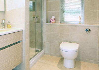 Tiled bathroom with bespoke vanity unit