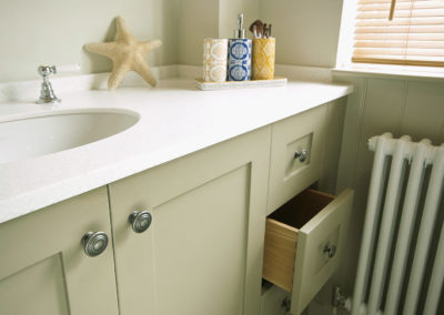 Bespoke wooden bathroom cabinet with Hi-Macs worktop